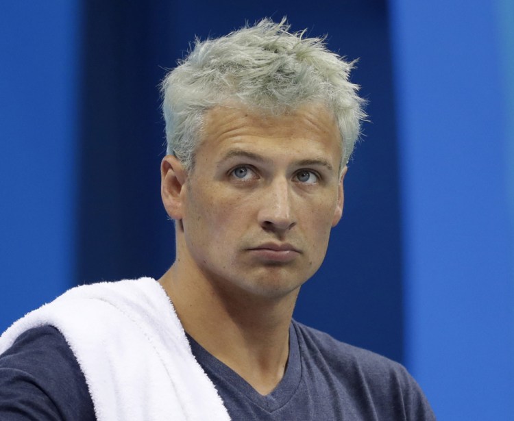 Ryan Lochte is banned from swimming through next June and will forfeit $100,000 in bonus money that went with his gold medal at the Olympics, part of the penalty for his drunken encounter at a gas station in Brazil during last month's games.
Associated Press/Michael Sohn, File