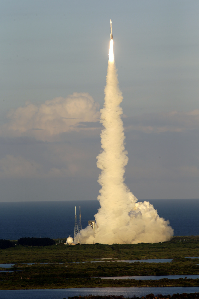 A United Launch Alliance Atlas V rocket carrying the Origins, Spectral Interpretation, Resource Identification, Security-Regolith Explorer (OSIRIS-REx) spacecraft lifts off from launch complex 41 at the Cape Canaveral Air Force Station, Thursday, Sept. 8, 2016, in Cape Canaveral, Fla. Osiris-Rex will travel to asteroid Bennu, collect ground samples, then haul them back to Earth. (AP Photo/John Raoux)