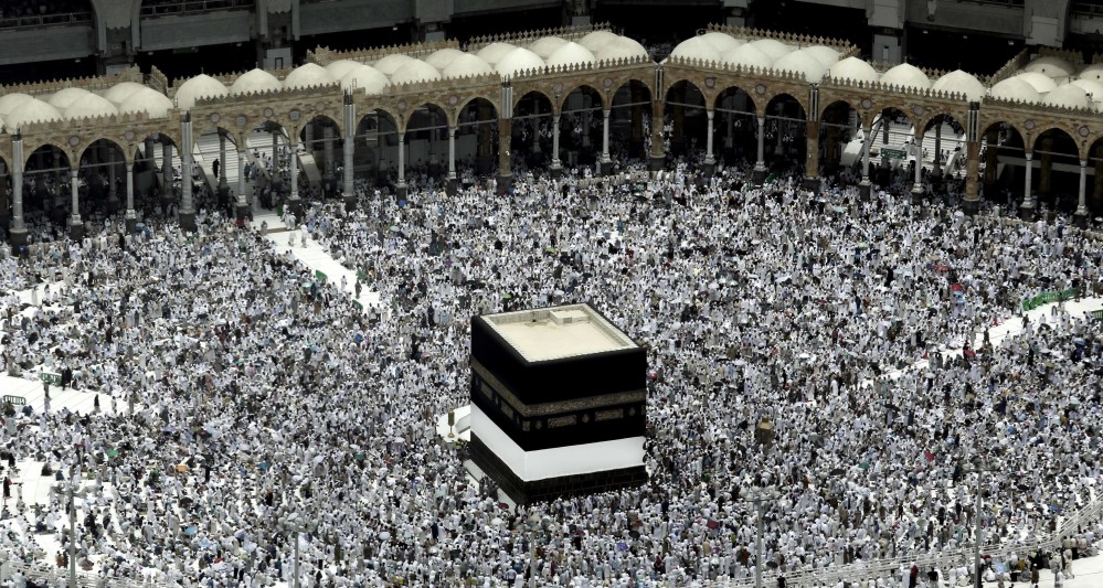 Muslim pilgrims prepare themselves for Friday prayers in front of the Kaaba, Islam's holiest shrine, at the Grand Mosque in the Muslim holy city of Mecca.