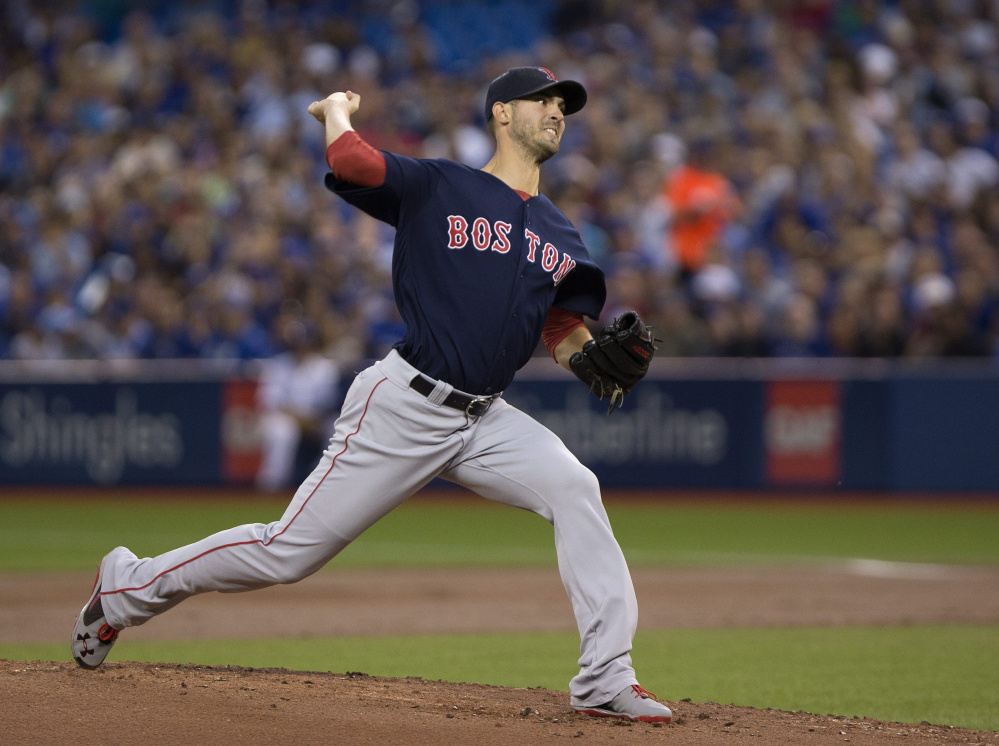 Boston Red Sox starting pitcher Rick Porcello delivers a pitch in the first inning against the Blue Jays in Toronto on Friday.