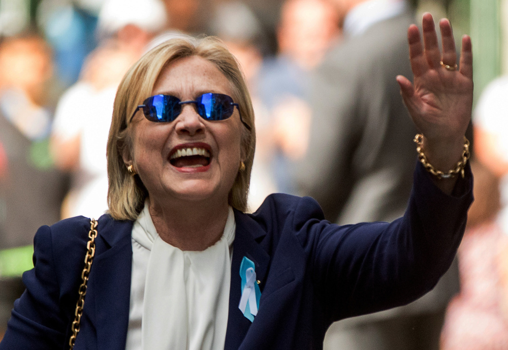 Democratic presidential nominee Hillary Clinton waves after leaving an apartment building Sunday in New York. 