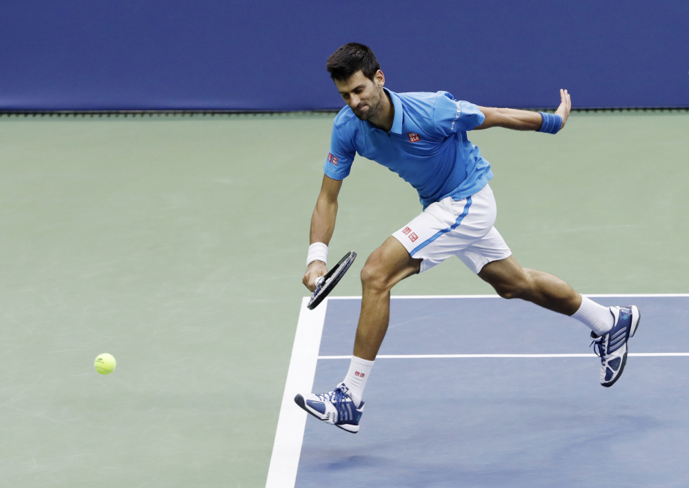Novak Djokovic fails to catch up with a shot from Stan Wawrinka at  the U.S. Open on Sunday in New York.