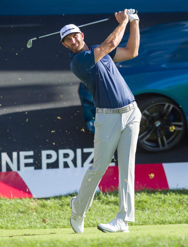 Dustin Johnson tees off from the 17th tee box during the final round of the BMW Championship golf tournament at Crooked Stick Golf Club in Carmel, Ind., Sunday, Sept. 11, 2016. Johnson won the tournament. (AP Photo/Doug McSchooler)