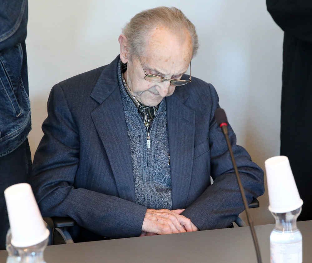 Former SS medic Hubert Zafke, who served at the Auschwitz death camp, sits in a courtroom ahead of his trial in Neubrandenburg, eastern Germany, on Monday.