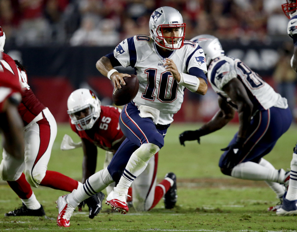 New England Patriots quarterback Jimmy Garoppolo scrambles against the Cardinals during the second half Sunday in Glendale, Ariz. Associated Press/Ross D. Franklin