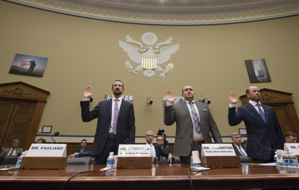 Witnesses, from left, Paul Combetta, Platte River Networks, Bill Thornton, Platte River Networks, and Justin Cooper are sworn in on Capitol Hill in Washington prior to testifying before the House Oversight and Government Reform Committee hearing on 'Examining Preservation of State Department Records.' Bryan Pagliano, former senior advisrr, Information Resource Management, Department of State did not appear.
