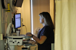Cara Small, an RN at Maine Medical Center, prepares to administer morning medication to a patient.