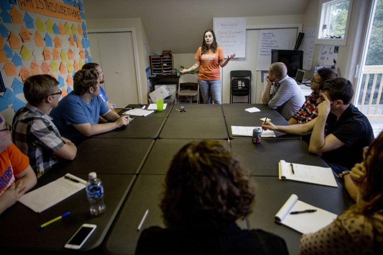 Erica Smegielski, the daughter of the Sandy Hook Elementary School principal who was killed while attempting to confront the shooter, speaks to a group of staff members at the Yes on 3 campaign headquarters in Portland.