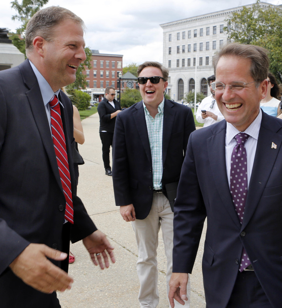 Republican gubernatorial candidates Executive Councilor Chris Sununu, left, and state Rep. Frank Edelblut joke Wednesday outside the Statehouse in Concord, N.H. Edelblut conceded the race for the Republican nomination for governor after Sununu won by fewer than 1,000 votes. He will run against his Democratic primary winner fellow Executive Councilor Colin Van Ostern.  (AP)