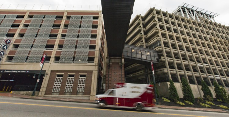Maine Med has two parking garages on Congress Street. An expansion plan calls for razing the employee garage, right, for a new 270,000-square-foot building, and adding three floors to the visitor garage, left.