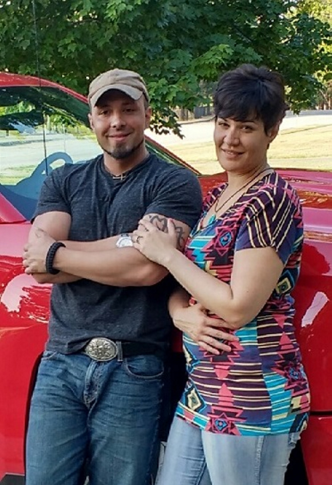 Valerie Tieman, right, was last seen Aug. 30. Behind Tieman and her husband is the truck she was last seen in at a Wal-Mart parking lot in Skowhegan.