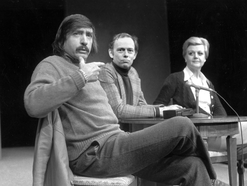 Edward Albee, left, makes a point as director Paul Weidner and actress Angela Lansbury look on during a news conference in Hartford, Conn., in January 1977. Albee continued to write provocative and unconventional plays into his 70s.