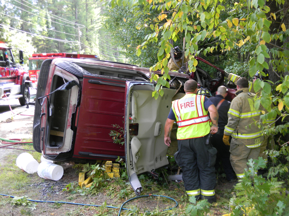 The Chevrolet Suburban lies off the side of Route 11 in Naples after Ruth Bliss, 48, drove it off the road and wrecked the vehicle early in the afternoon of Saturday, Sept. 17, 2016.