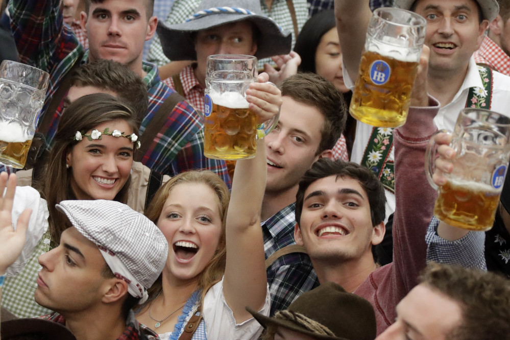 Young people celebrate the opening of the 183rd Oktoberfest beer festival in Munich on Saturday. Security was tight at the world's largest beer festival, which will is being held from Sept. 17 to Oct. 3.