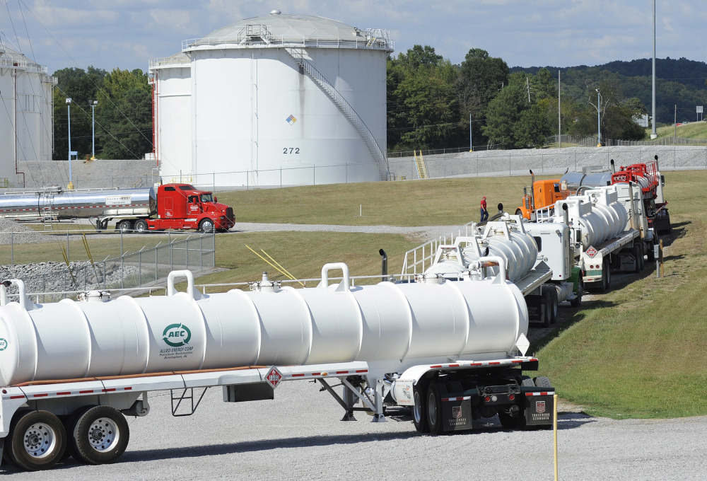 Tanker trucks line up at a Colonial Pipeline Co. facility in Pelham, Ala., near the scene of a 250,000-gallon gasoline spill on Friday, Sept. 16, 2016. The company says spilled gasoline is being taken to the storage facility for storage. Some motorists could pay a little more for gasoline in coming days because of delivery delays.