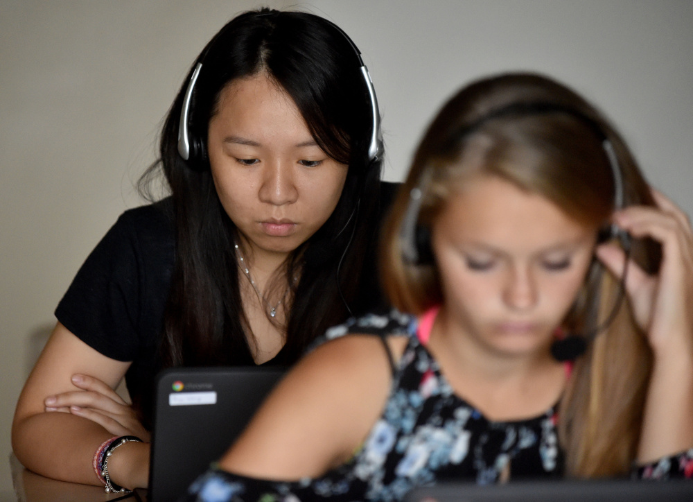 Paige Wong, a senior exchange student from Taiwan, works through Rosetta Stone lessons during Spanish class at Madison Area Memorial High School. She says she appreciates the program's
focus on listening and conversation.