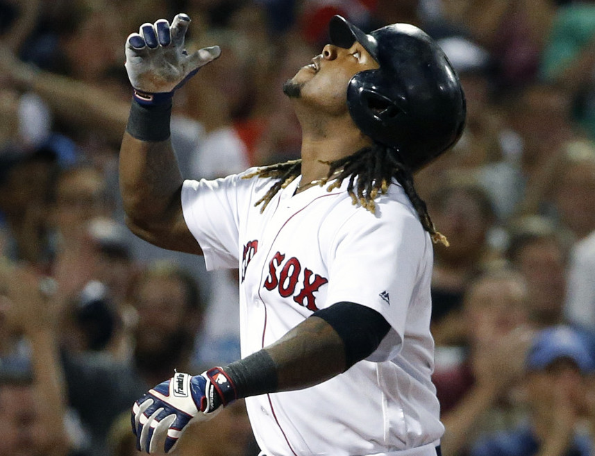 Boston's Hanley Ramirez celebrates after hitting a three-run home run in the fifth inning of the Red Sox game against the Yankees on Sunday night in Boston. Ramirez homered twice.
