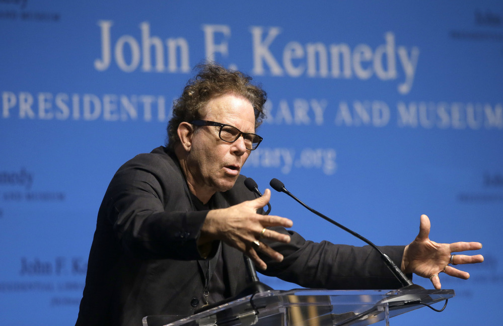 Tom Waits addresses an audience at the Song Lyrics of Literary Excellence Awards in Boston Monday, where he and his wife, Kathleen Brennan, and John Prine were honored.