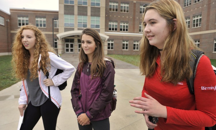 South Portland juniors, from left, Shannon Murphy, Carolyn Breau and Chloe Birmingham say cutting two dances a year will hurt fundraising for the senior prom.