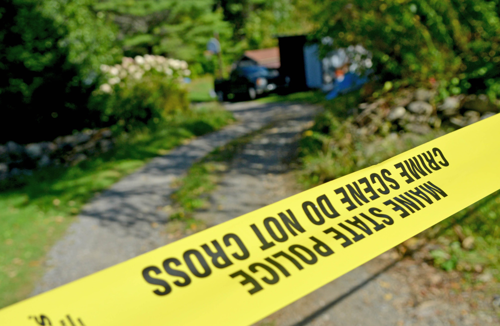 Police tape marks off the driveway to the Tieman residence at 628 Norridgewock Road in Fairfield on Tuesday after Valerie Tieman's body was discovered buried on the property. An autopsy by the state Medical Examiner's Office this week determined the cause of death was two gunshot wounds to the head.