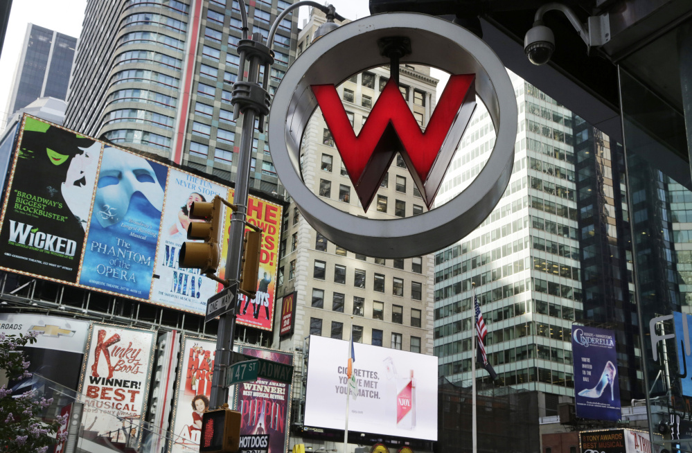 The logo for the W hotel hangs in New York's Times Square. The W hotel was owned by Starwood Hotels & Resorts Worldwide but now falls under the Marriott International umbrella.