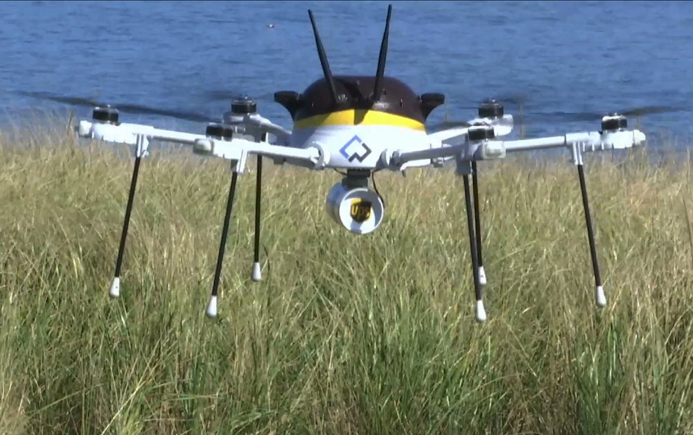 A UPS test drone lands Thursday on Children's Island off Massachusetts. UPS partnered with robot-maker CyPhy Works to fly the drone on a programmed route for 3 miles over the Atlantic Ocean to make the mock delivery of an asthma inhaler.