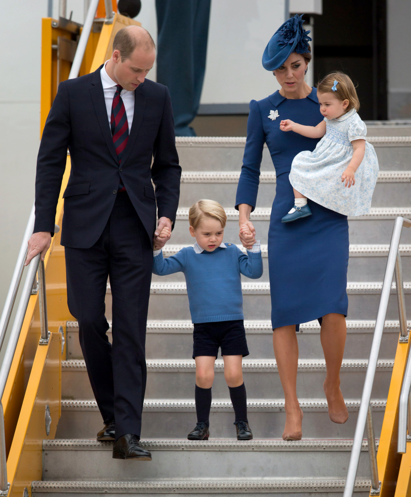 Britain's William and Kate, the Duke and Duchess of Cambridge, along with their children Prince George and Princess Charlotte step off the plane Saturday in Victoria, British Columbia.
