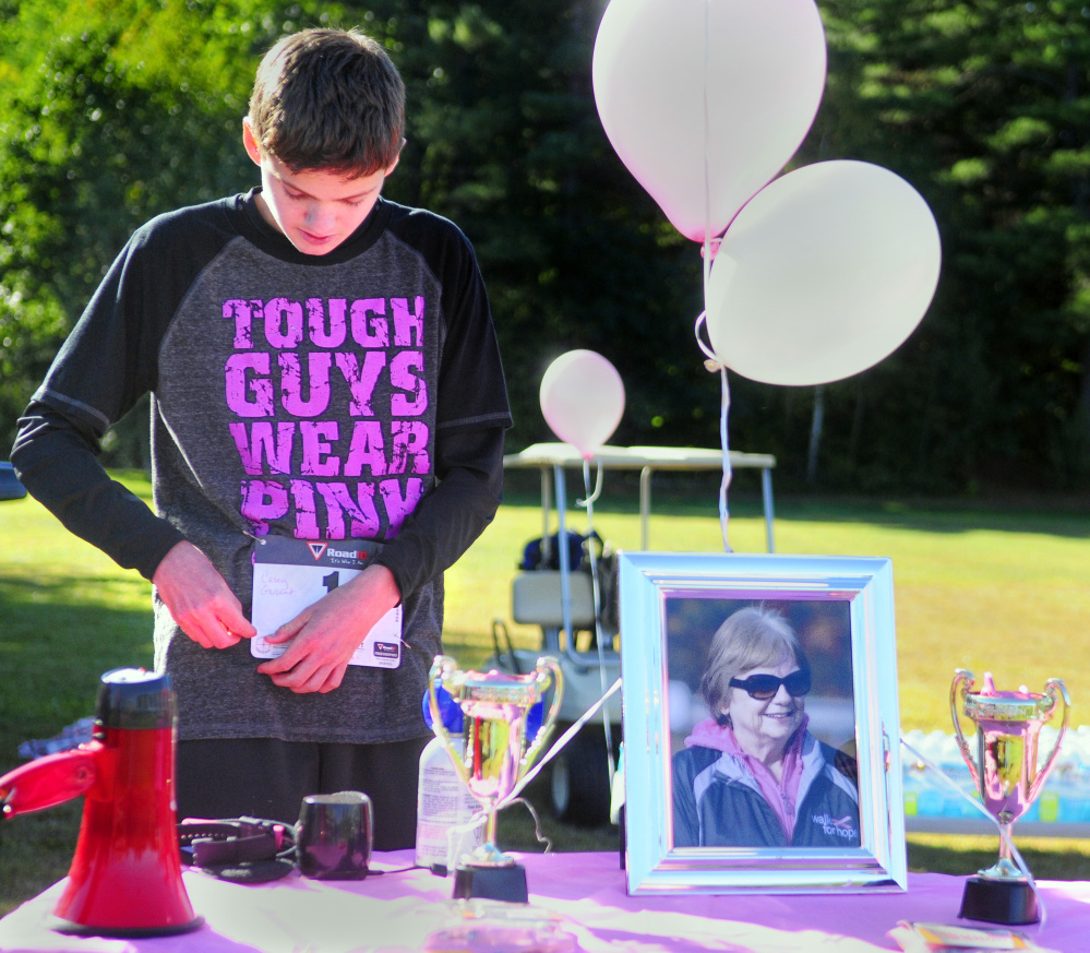 Casey Gallant, with a framed photo of his late grandmother Lois Lajoie, raised $4,500 to fight breast cancer.