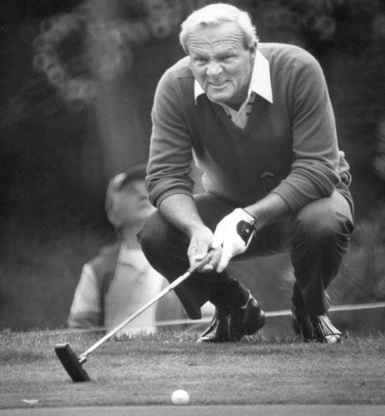 Arnold Palmer lines up a putt on the seventh hole at Purpoodock Club in Cape Elizabeth during the Unionmutual Seniors Golf Tournament in 1986. Palmer played in the tournament all three years it was held, winning in 1986 despite putting jitters.