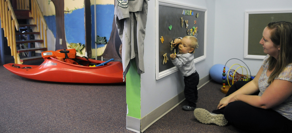 Archer White, 1, plays Thursday with his mother, Jamie, at the Children's Discovery Museum in Augusta. The museum, which started in 1984 as a series of traveling exhibits, has announced it is relocating to Waterville.