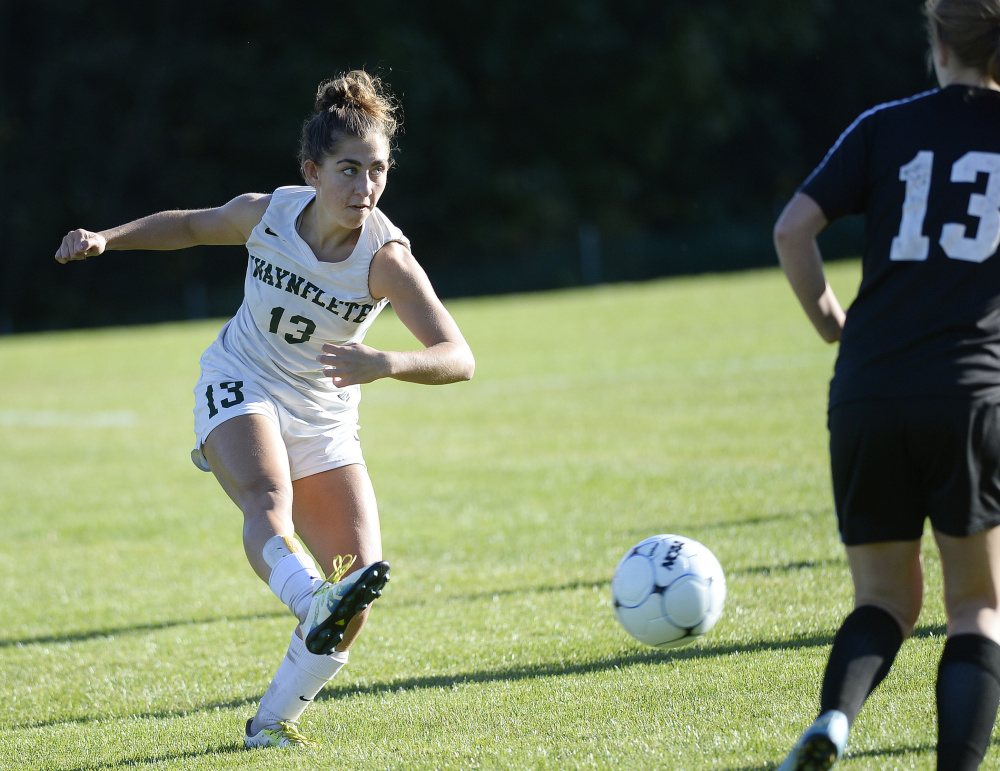 Waynflete's Amelia Bertaska sends the ball up the field during Thursday's game in Portland. Bertaska scored one of the Flyers' three second-half goals. Shawn Patrick Ouellette/Staff Photographer