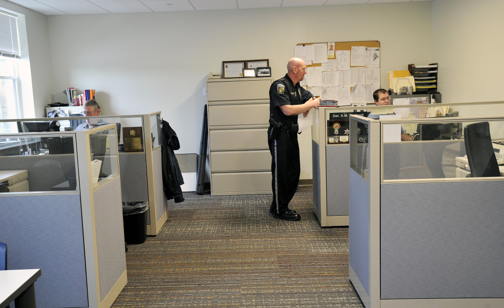 Officers and detectives work in the new Gorham public safety building Gorham on Tuesday. Police share the renovated complex with the fire department, where Chief Robert Lefebvre says, "Now we feel like a professional organization."