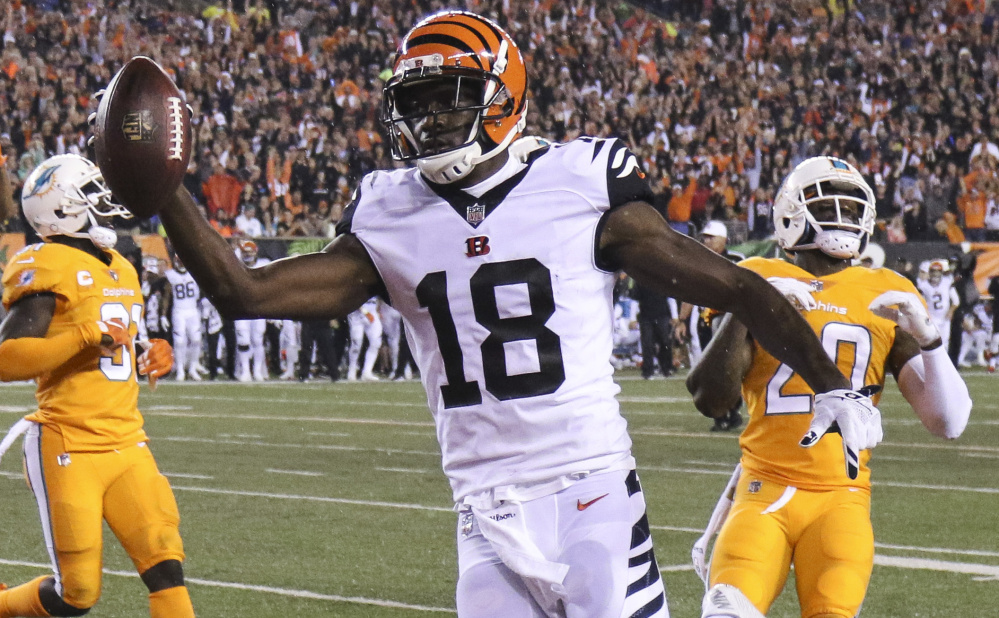 Cincinnati Bengals wide receiver A.J. Green, center, scores a touchdown during the first half of a 22-7 win over the Miami Dolphins at Cincinnati on Thursday. Green finished with 173 yards receiving on the night.