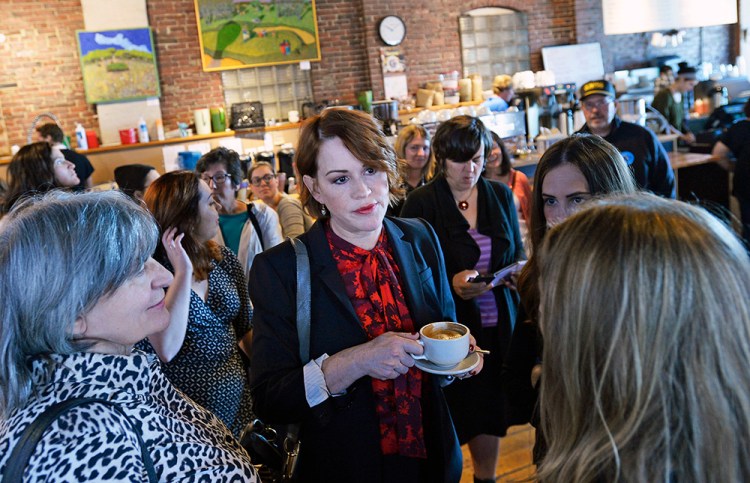 Actress Molly Ringwald talks with Hillary Clinton supporters at Arabica Coffee House on Commercial Street in Portland Tuesday. She also had stops to make at a voter registration drive, a phone bank event and happy hour at Portland Hunt & Alpine Club.