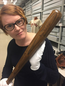 Kristen Gwinn-Becker of HistoryIT holds Babe Ruth's bat while preparing the Hall of Fame's digital archive project. The first portion of the digital archive, Babe Ruth's personal scrap books, was launched last week. Photo courtesy Kristen Gwinn-Becker 