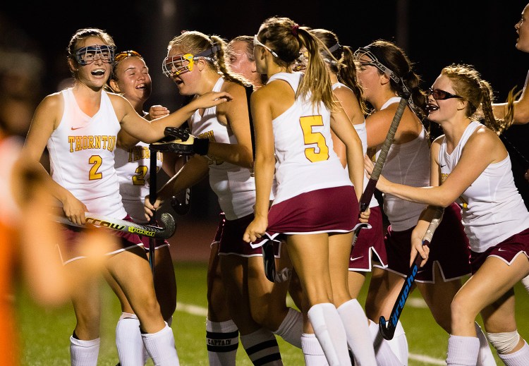 Thornton Academy’s Grace Decker is congratulated by teammates after scoring on a first-half penalty shot, the Trojans’ first of six goals goal against Biddeford. 
Carl D. Walsh/Staff Photographer