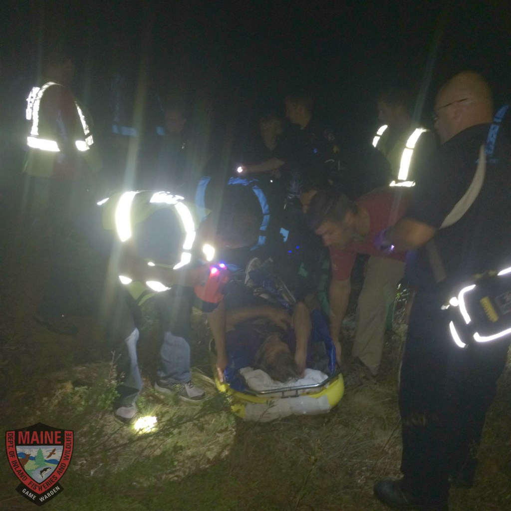 Rescuers tend to a man who suffers from dementia who got lost in the woods in Camden on Tuesday night. 