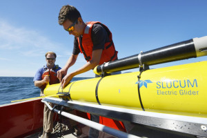 Woods Hole Oceanographic Institution engineers Sean Whelan, left, and Patrick Deane prepare to release a Slocum glider into the waters south of Martha's Vineyard, Mass. Ken Kostel/Woods Hole Oceanographic Institution via AP