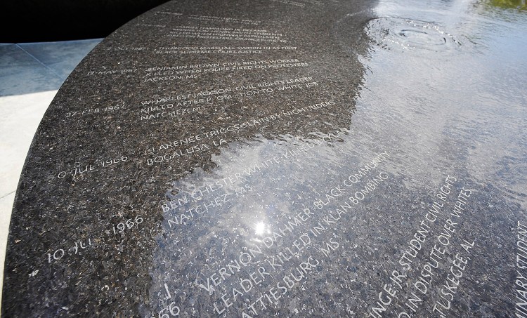 Water flows over names on a memorial to people killed during the civil rights movement in Montgomery, Ala. The group that erected the marker is planning a memorial and museum to black lynching victims in the city long known as the first capital of the Confederacy.    Associated Press/Jay Reeves