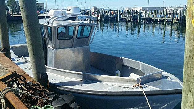 The 31-foot aluminum craft that Nathan and Linda Carman were aboard when they left a Rhode Island marina to go on a fishing trip. <em>Photo courtesy of U.S. Coast Guard</em>