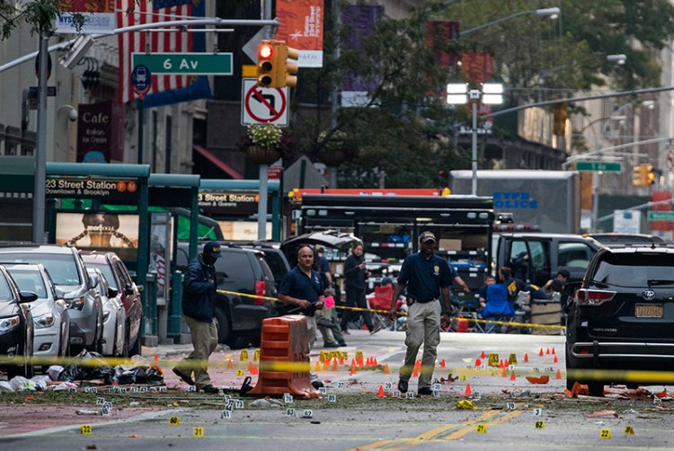 Crime scene investigators work on Sunday at the scene of last night's explosion in Manhattan.