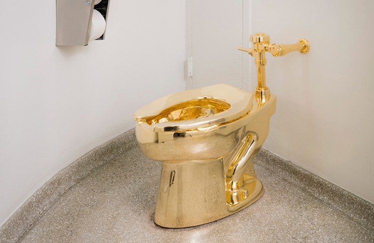 A fully functioning 18-karat gold toilet awaits the adventurous in the Guggenheim Museum's 14th-floor restroom. It's part of Italian artist Maurizio Cattelan 's "America" exhibit. 