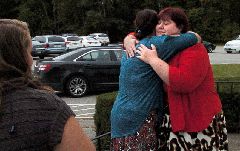 Emily Rowden- Fournier, right, hugs Shana Page prior to a memorial service for their friend Valerie Tieman at the Fairfield United Methodist Church on Sunday. All three were members of the Recycled Shakespeare Company.