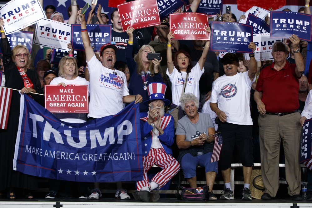Supporters of Republican presidential candidate Donald Trump cheer during a campaign rally, Tuesday, Oct. 4, 2016, in Prescott Valley, Ariz. (AP Photo/ Evan Vucci)