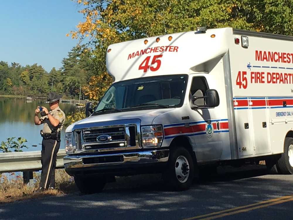 A Kennebec County sheriff's deputy works on Pond Road in Manchester on Thursday morning after the body of an 84-year-old man was pulled from Lake Cobbossee.