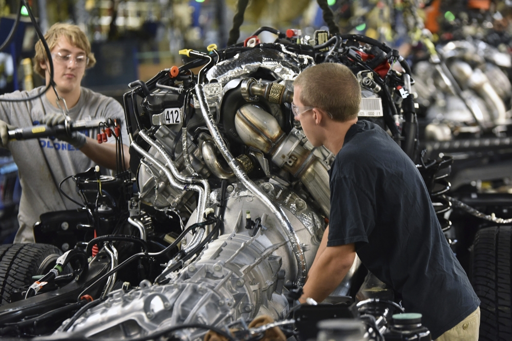 Workers assemble a 2017 Ford F-Series Super Duty truck at the Kentucky Truck Plant in Louisville, Ky. Friday's September jobs report showed the unemployment rate has remained mostly flat even as hiring has been solid.