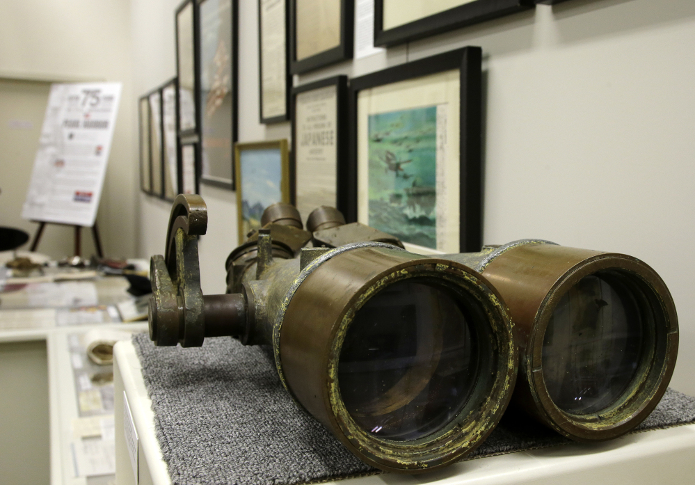 Binoculars once belonging to the battleship USS Arizona are on display as part of an exhibit at The Museum of World War II in Natick, Mass.