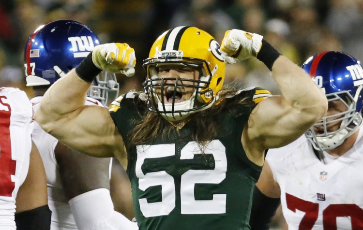 Green Bay Packers' Clay Matthews celebrates a sack of New York Giants quarterback Eli Manning during the second half Sunday.   Associated Press/Mike Roemer