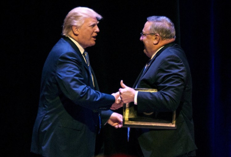 Gov. Paul LePage welcomes Donald Trump to the stage at an Aug. 4, 2016 campaign rally in Portland. 