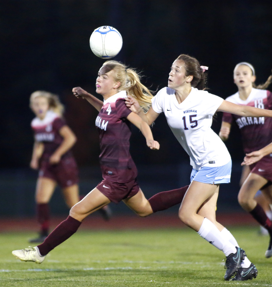 Tiril Wiig of Gorham, left, gains a step on Windham's Hannah Kaplan in the first half Wednesday. Wiig scored a goal in each half for the Rams, who remained unbeaten with a 3-1 win.